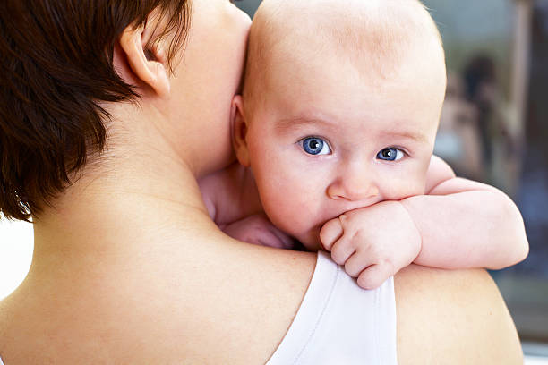 istock baby boy with hand in mouth 147268434