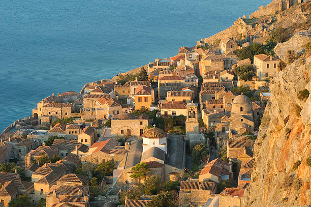 Beautiful view of a mountain side town in Monemvasia, Greece Medieval walled town of Monemvasia, Greece monemvasia stock pictures, royalty-free photos & images