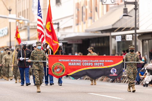 Brownsville, Texas, USA - February 26, 2022: Charro Days Grand International Parade, Members of the Veterans Memorial Early College High School Marine Corps JROTC, maching in full military uniforms at the parade
