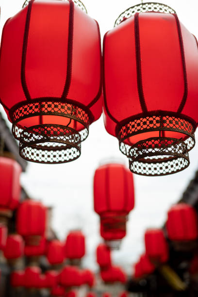 istock Red Chinese lanterns hanging in a street 1472698238