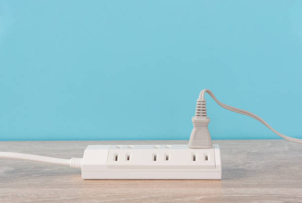 istock Power strip and electrical outlet on the floor. 1472701405
