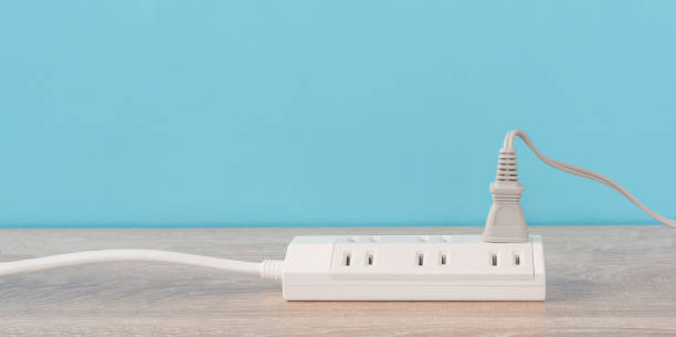 istock Power strip and electrical outlet on the floor. 1472701407