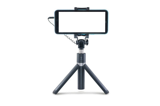 istock Tripod selfie stick with mobile phone. 1472701673