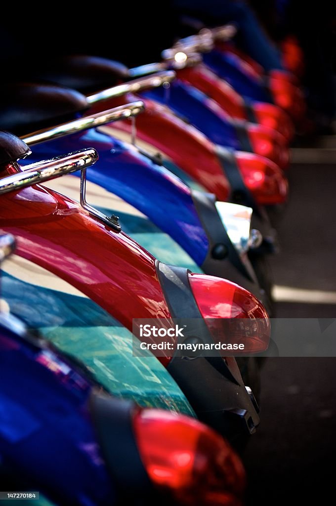 Scooter saddles A set of scooter saddles lined up in a row Blue Stock Photo