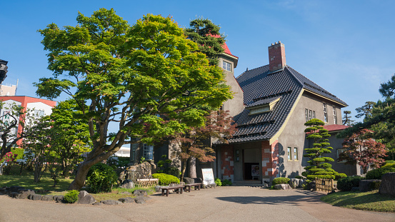A fancy brick house used as a tea house in front of Hirosaki Castle, Aomori, Japan. The Taisho era architecture gives the cafe a great retro aesthetic while incorporating a nice garden within the compound.