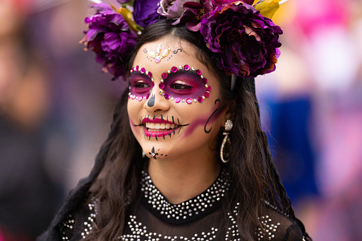 Matamoros, Tamaulipas, Mexico - November 1, 2022: Dia de los Muertos Parade, Members of the Villa Freinet Multicultural School dress up as catrinas, dancing at the parade