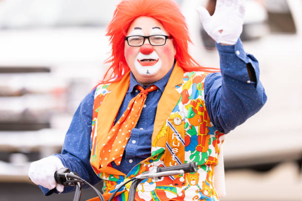 Laredo, Texas, USA - February 19, 2022: The Anheuser-Busch Washingtons Birthday Parade, Clown riding a mini bike