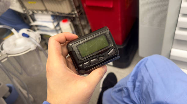 istock hospital and work pager or beeper used for messaging and communication for professional business 1472711676
