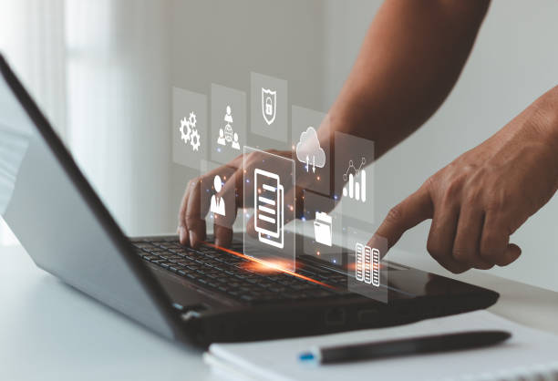 istock Document management system concept with icons on virtual screen, ERP, Businessman working on the computer for document management concept, online documentation database, digital file storage system. 1472712532