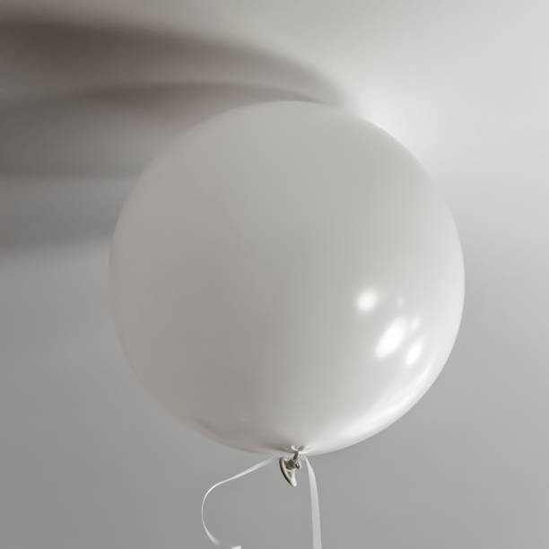 istock Balloons filled with helium 1472714146