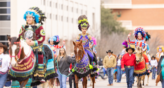 Laredo, Texas, USA - February 19, 2022: The Anheuser-Busch Washingtons Birthday Parade, Members of the Princess Pocachontas Council wearing traditional Native American Clothing, riding horses