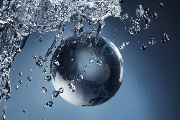 istock glass globe planet in drop water splash on blue background 1472719991
