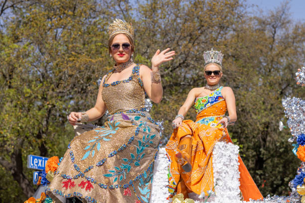 San Antonio, Texas, USA - April 8, 2022: The Battle of the Flowers Parade, Float Carrying the Cuchess of the festival wearing crowns and traditional dresses during the parade