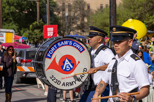 San Antonio, Texas, USA - April 8, 2022: The Battle of the Flowers Parade, Members of the Fort Sams Own 323D Army Band, performing at the parade