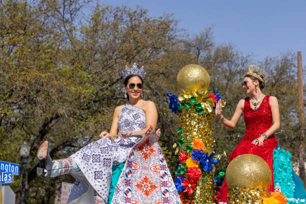 San Antonio, Texas, USA - April 8, 2022: The Battle of the Flowers Parade, Float Carrying the Cuchess of the festival wearing crowns and traditional dresses during the parade