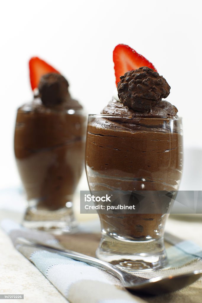 chocolate mousse strawberry Chocolate mousse made from dairy double cream with strawberry on the top. Shallow depth of field. Brown Stock Photo