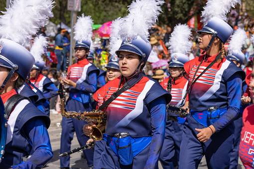 San Antonio, Texas, USA - April 8, 2022: The Battle of the Flowers Parade, The Thomas Jefferson High School Mustang Band performing at the parade