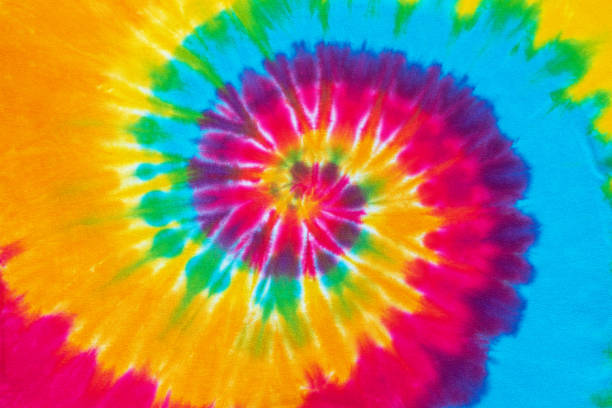 spiral tie dye pattern background spiral tie dye pattern hand dyed on cotton fabric abstract texture background. tie dye stock pictures, royalty-free photos & images