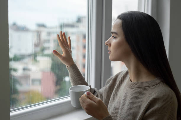 Lonely woman feeling alone and negative emotion Lonely woman feeling alone and negative emotion seasonal affective disorder stock pictures, royalty-free photos & images