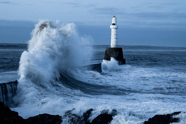 istock Light house and the storm 1472732715