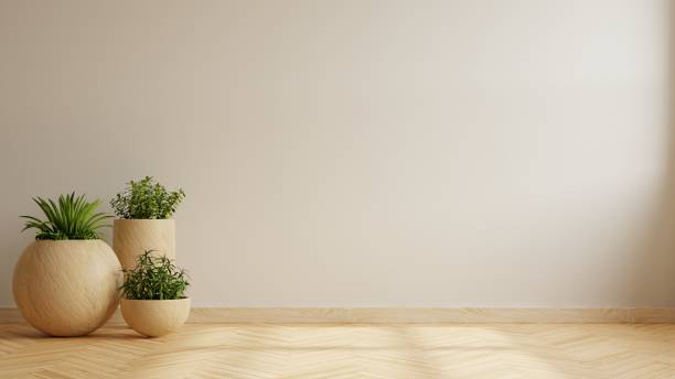 istock Wall mockup with plant set on wooden flooring. 1472733609