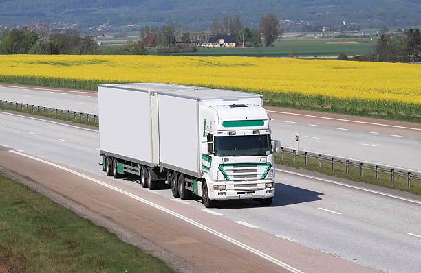 istock White truck and a yellow field. 147273524