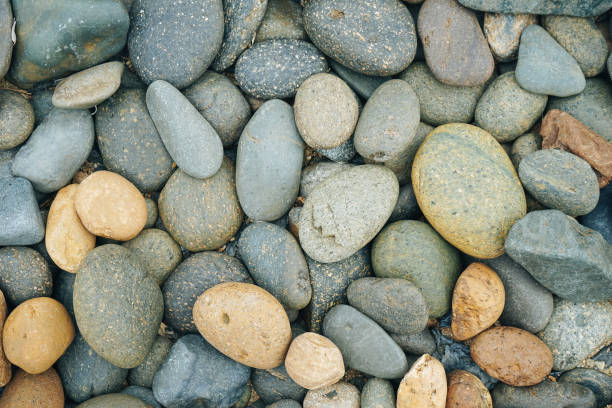 istock Pebbles stone or river stone  background with vintage filter 1472735783