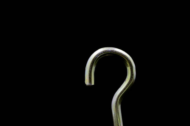 metal question mark screw  isolated on black background