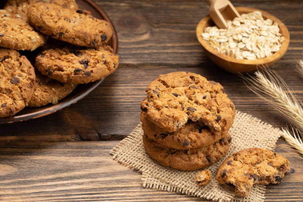 istock Oatmeal cookies on a wooden table. 1472736742