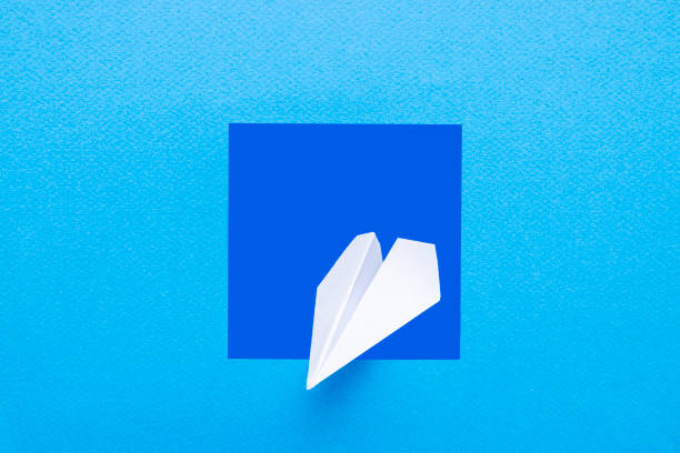 istock White color paper airplane coming out 1472737081