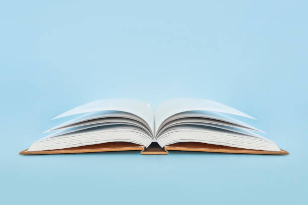 istock book with hard cover on blue background 1472738047