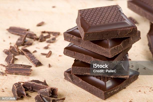 Chocolate Chunks Stacked Stock Photo - Download Image Now - Block Shape, Chocolate, Cutting Board