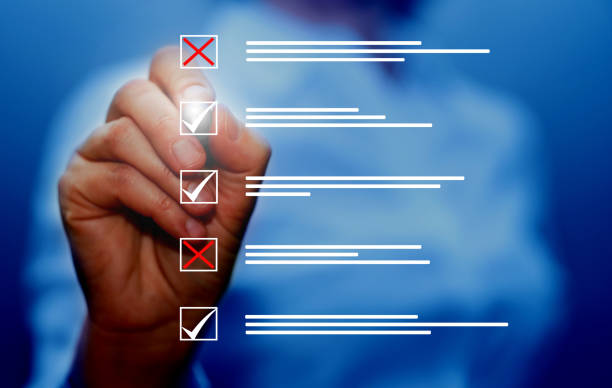istock Survey form, check marks on checklist, filling online form and answering questions concept background. 1472739882