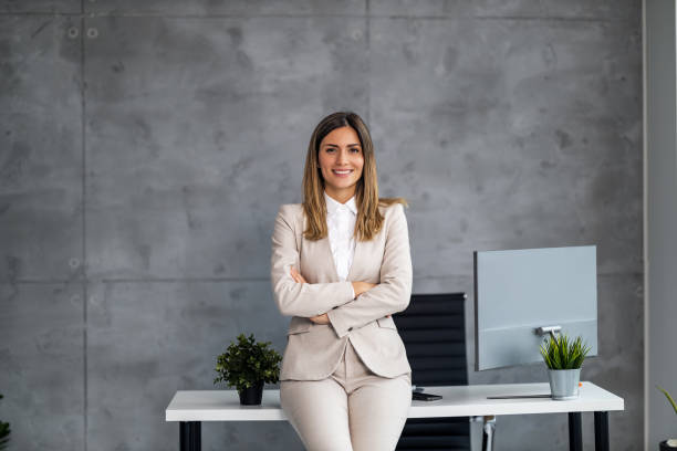 istock Smiling businesswoman at work 1472742208