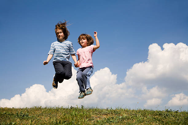 istock jamp of sisters on the sky 147274436