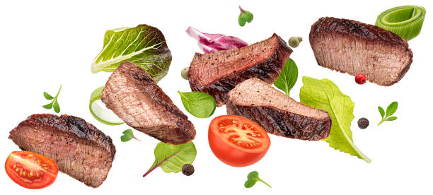 istock Falling steak salad ingredients isolated on white background 1472744408