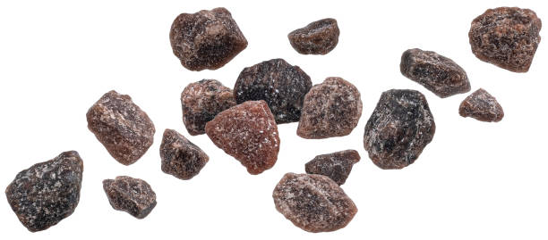 istock Falling black himalayan salt isolated on white background 1472744527