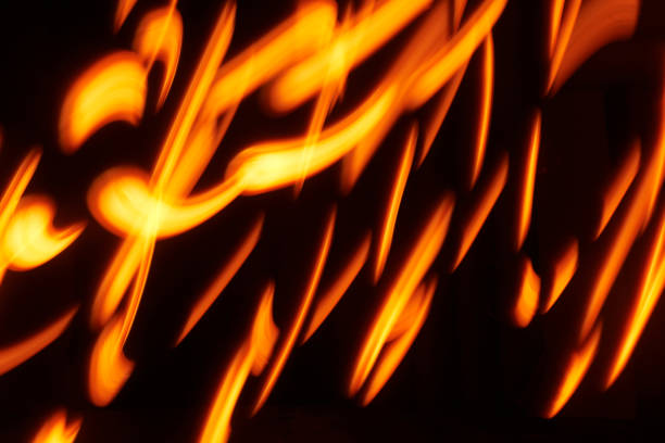 istock Chaotic yellow lines on a black background 1472745768
