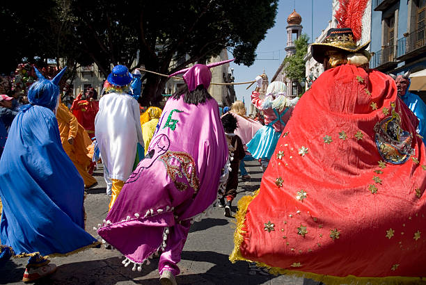 istock Puebla mexican carnival - running people 147274586