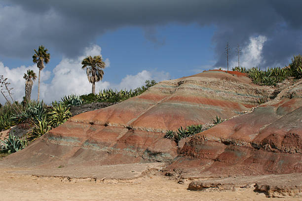 coloured cliffs with dramatic sky stock photo