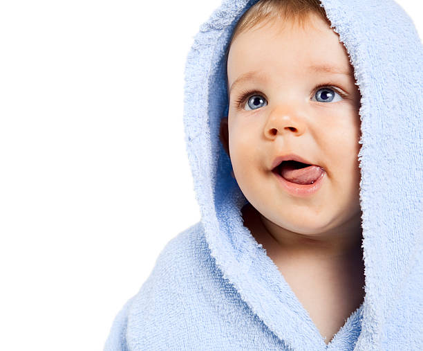 Hungry baby boy with tongue out stock photo