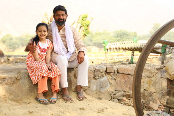 istock Father and Daughter siting together 1472748499