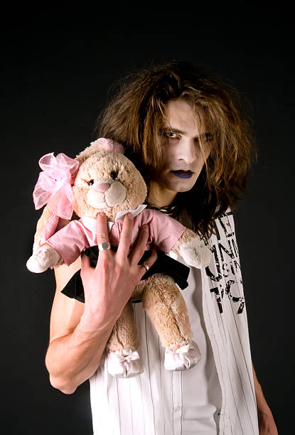 istock Gothic boy with a plush toy 147274974