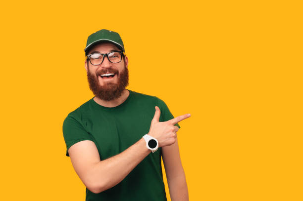 istock Just look there says a bearded man wearing green uniform while pointing aside. 1472750040