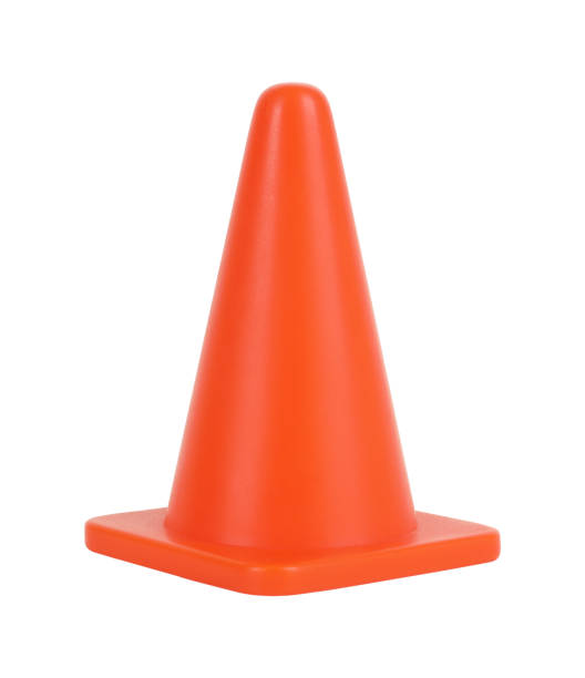 Traffic cone orange pylon isolated on white background stock photo