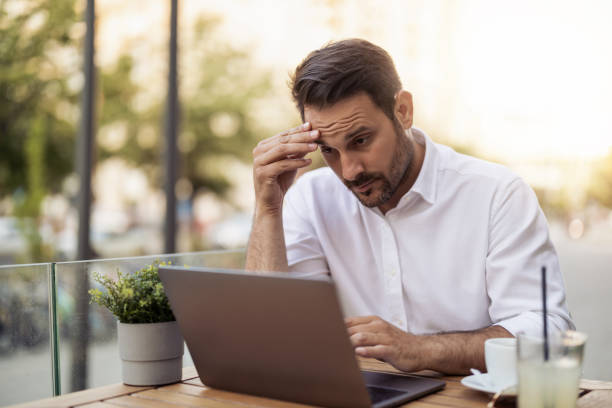 istock Businesswoman using laptop at cafe 1472750908