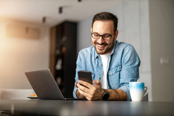 istock Man using laptop, writing email,online meeting or payment online 1472752482