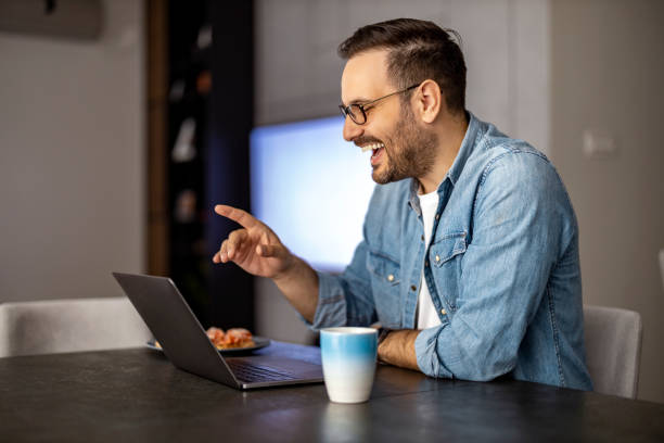istock Man using laptop, writing email,online meeting or payment online 1472752502