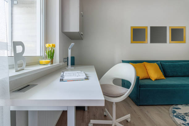 istock Stylish teenager's room interior with comfortable bed and workplace 1472752587