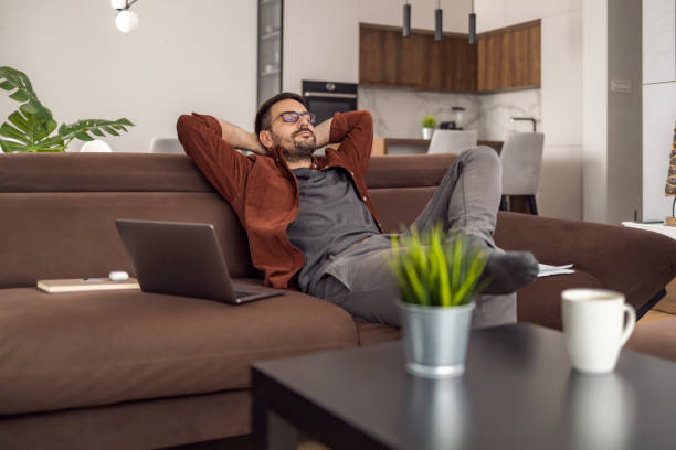 istock Man using laptop, writing email,online meeting or payment online 1472753901